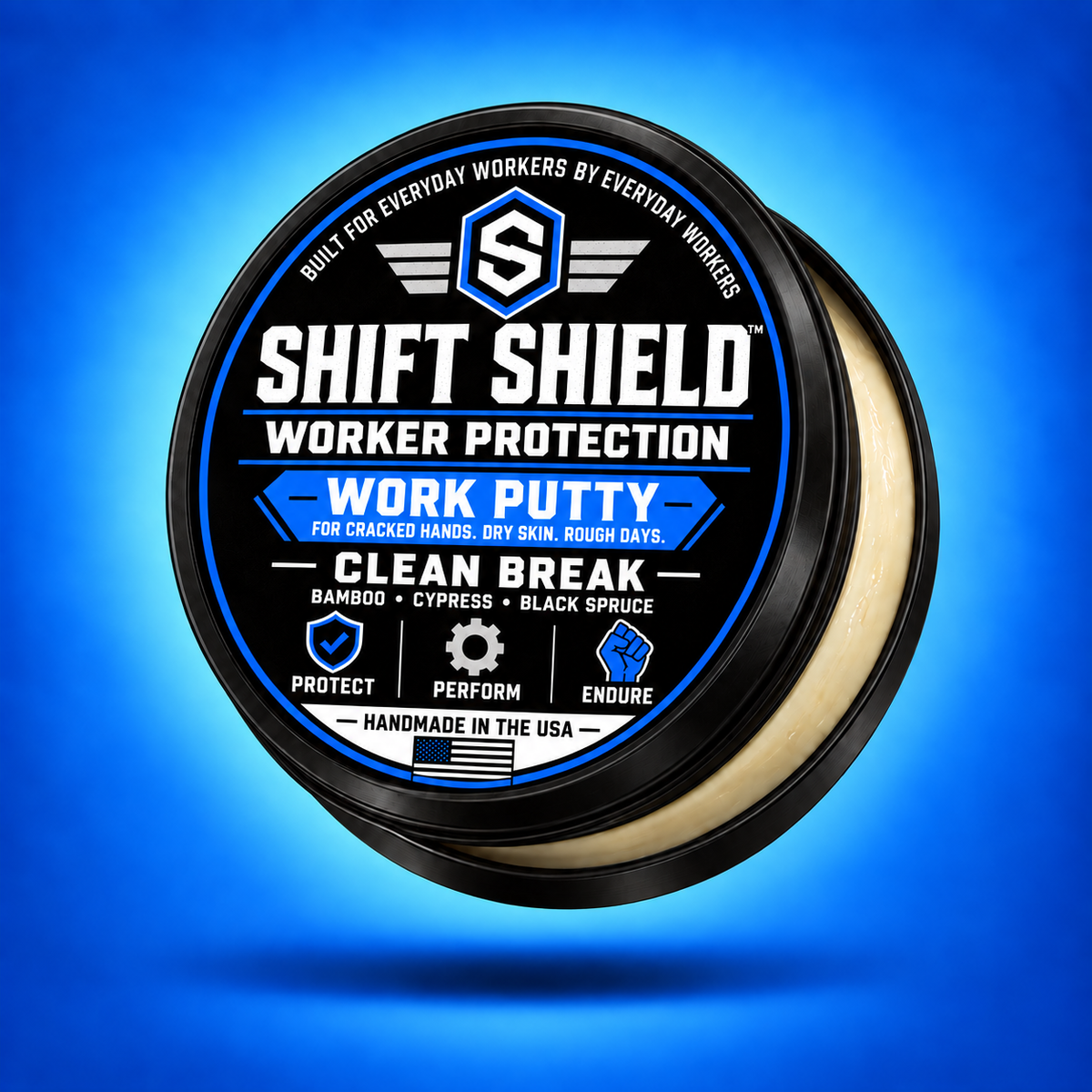 Shift Shield Clean Break Work Putty 2 oz black tin with updated label, slightly open against a blue background