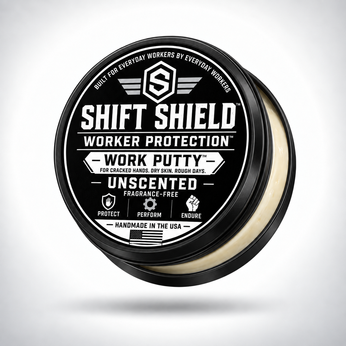 Shift Shield Work Putty unscented 2 oz black tin with lid slightly open